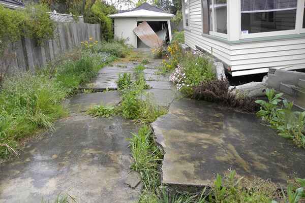 Image: Liquification of a walkway. Earthquake motion can turn loosely packed, water saturated soil to liquid—this is called liquefaction