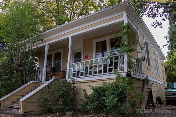 Image: A raised foundation house. A house with a raised foundation has an area underneath the first floor, which is referred to as a crawl space.