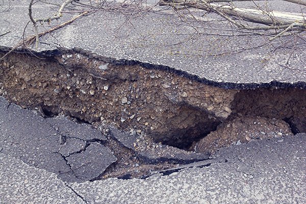 Image: Photo of surface rupture of asphalt after an earthquake.