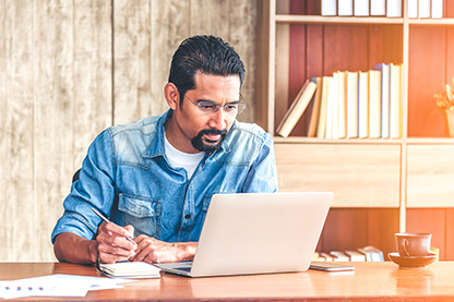 Image: Male at laptop