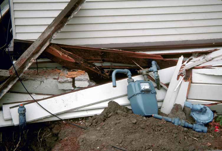 Image: Broken utility lines in house that shifted off its foundation, downtown Watsonville - 1989 Loma Prieta earthquake.