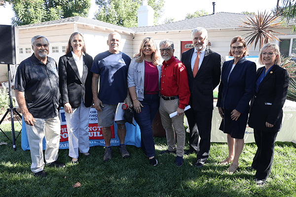 Image: Homeowner Paige Oliver and State Senator Anthony Portantino (in the center) surrounded by CEA executives, CRMP board members and local officials at the 2022 EBB Registration Launch in Burbank