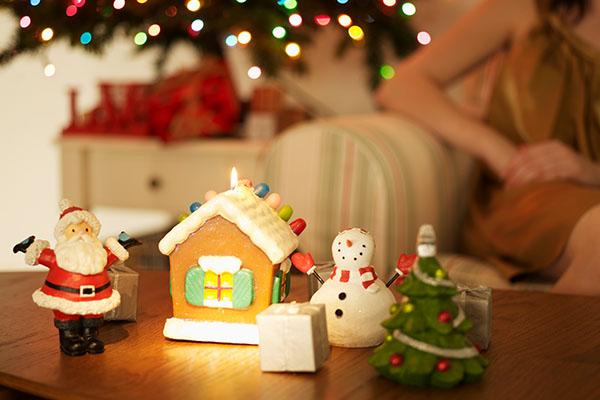 Image: Christmas decorations on table with a woman in background