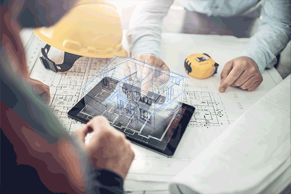 Image: Table with seismic retrofit blueprints, people and a hardhat